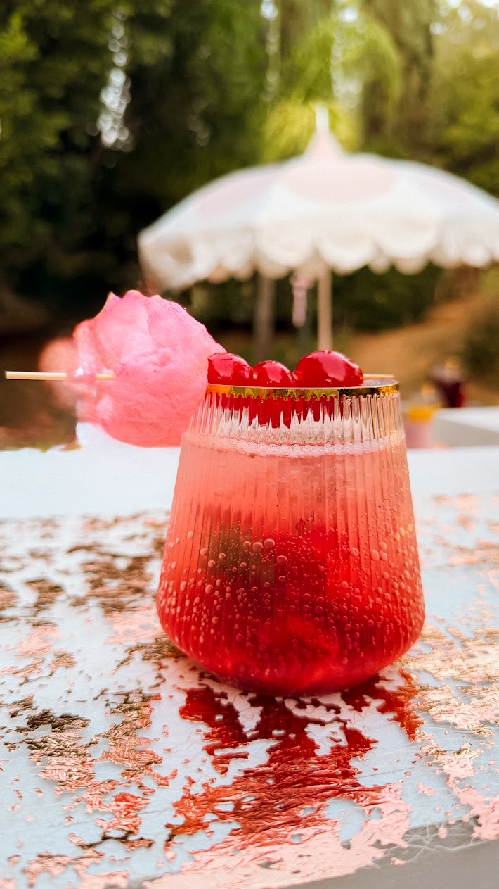 Cherry soda with cotton candy garnish