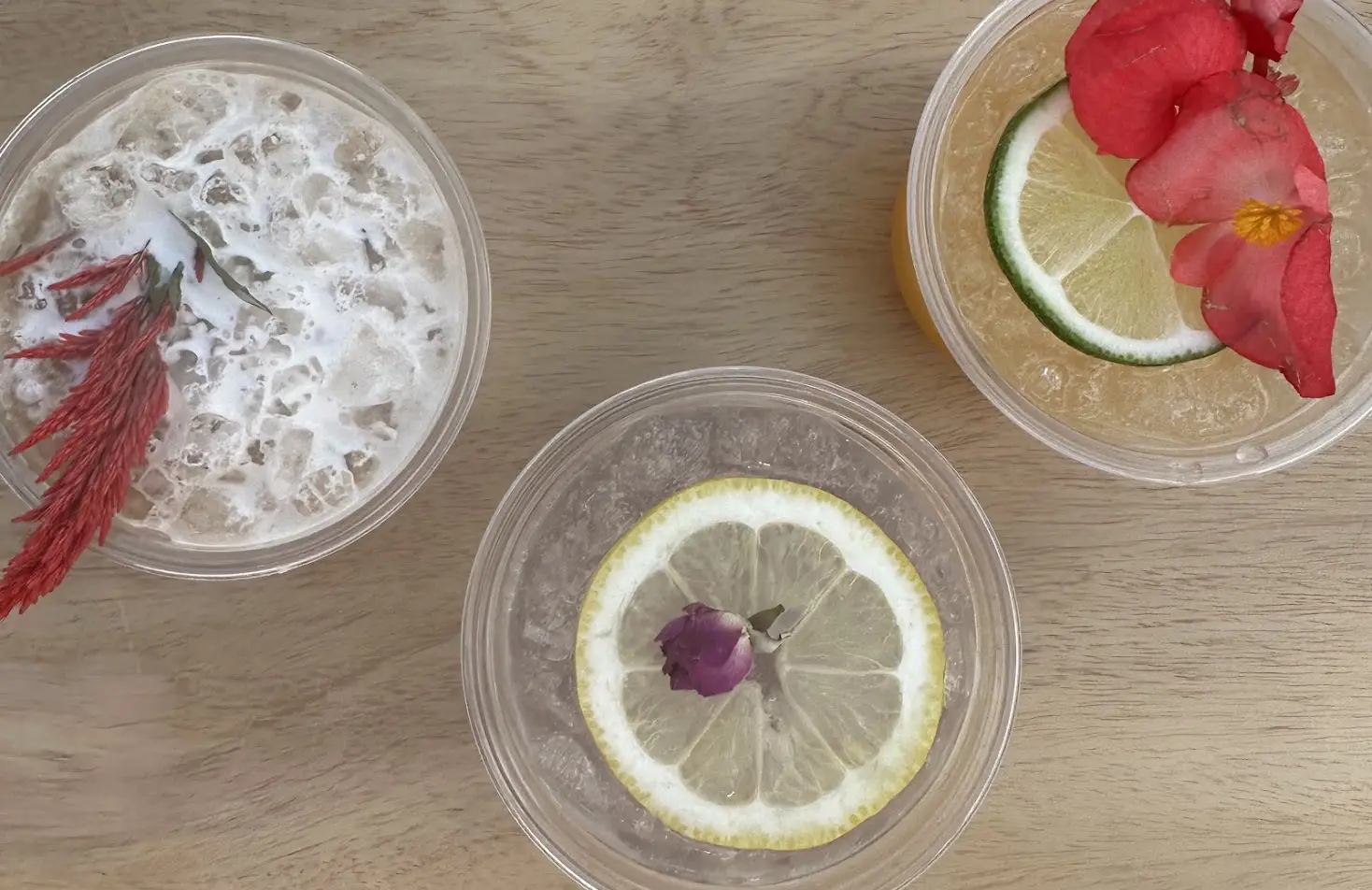 Custom mocktails garnished with citrus wheels and edible flowers for a graduation party in Southern California