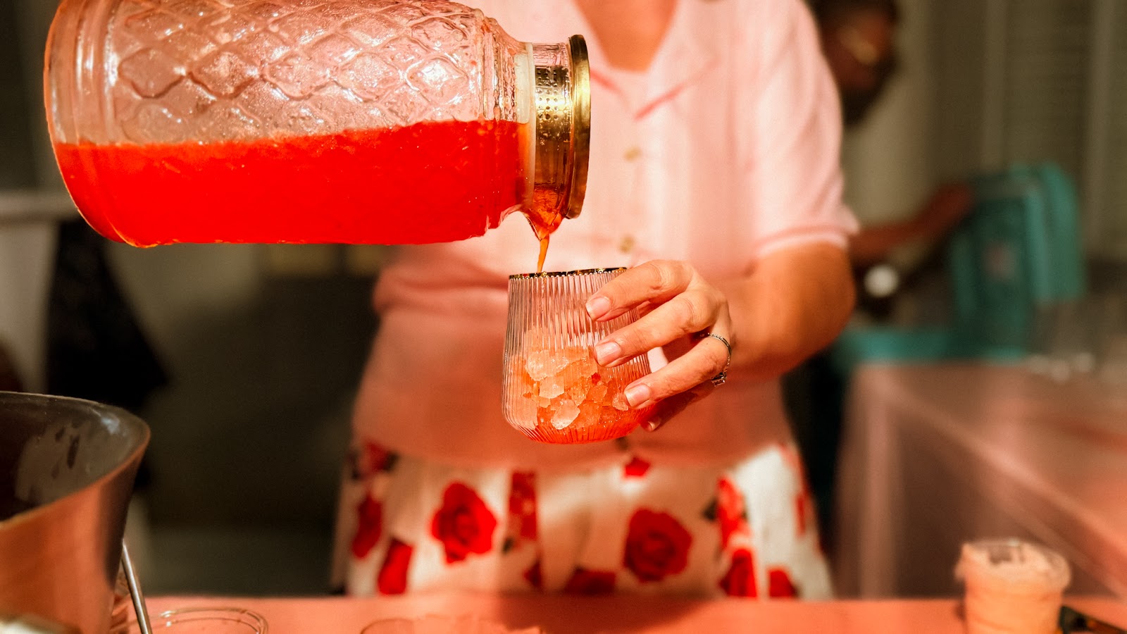 Bartender crafting a herb-infused mocktail for guests